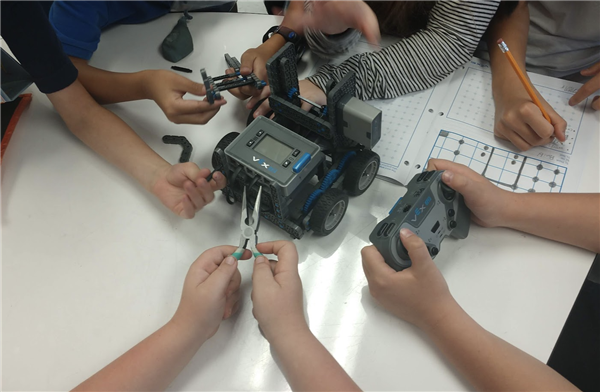 Students assembling a robot